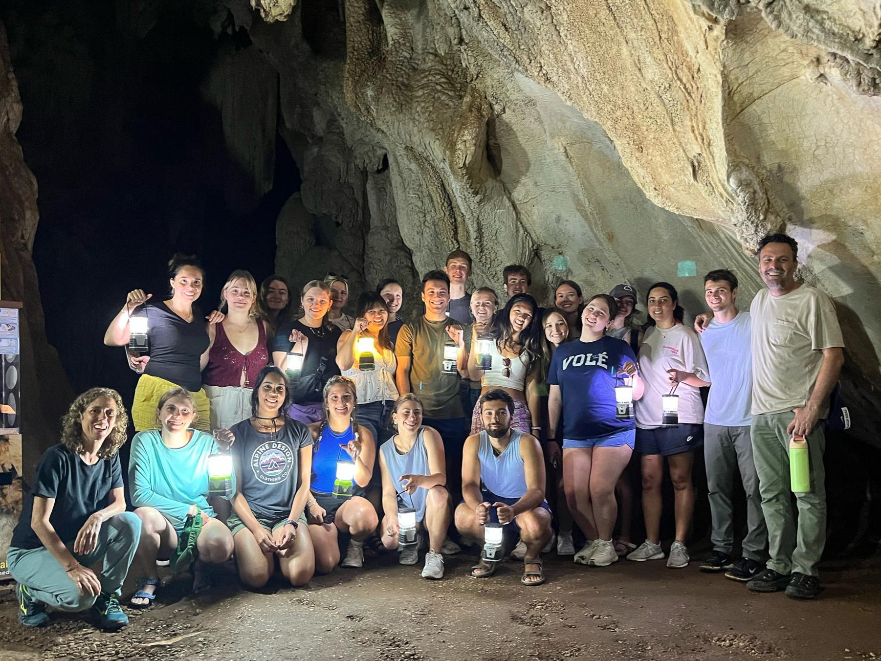 Students and faculty gather inside the Cueva de la Pileta cave.