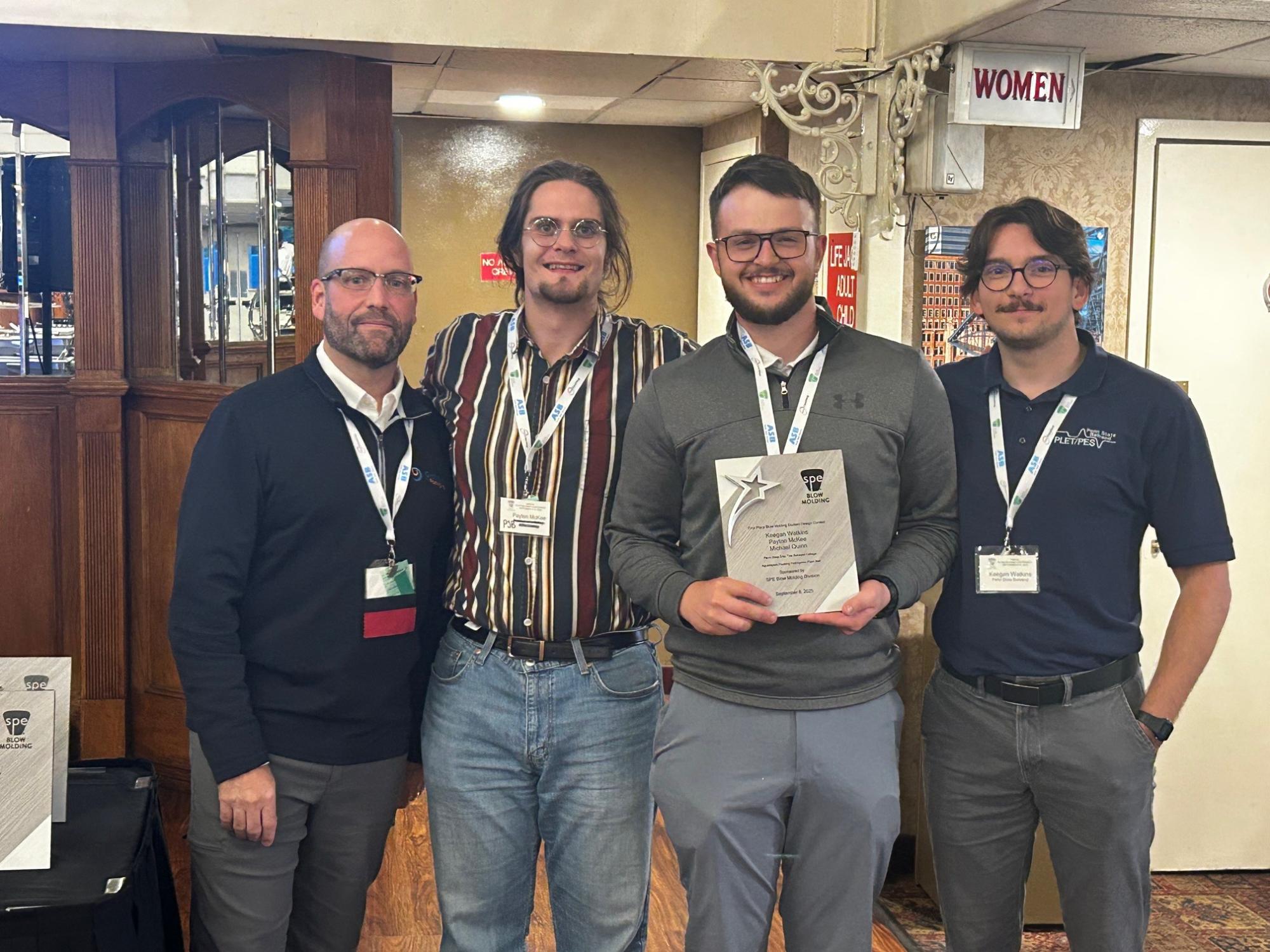 A student team poses with certificates after the blow molding competition at the SPE conference in Pittsburgh.