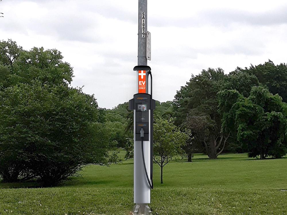 A streetlight with an EV charging station. 