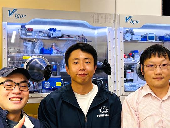 People standing in a lab, looking at the camera