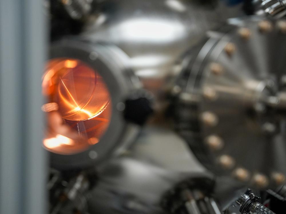 Cool photo showing plasma firing off inside a vacuum chamber in a lab.