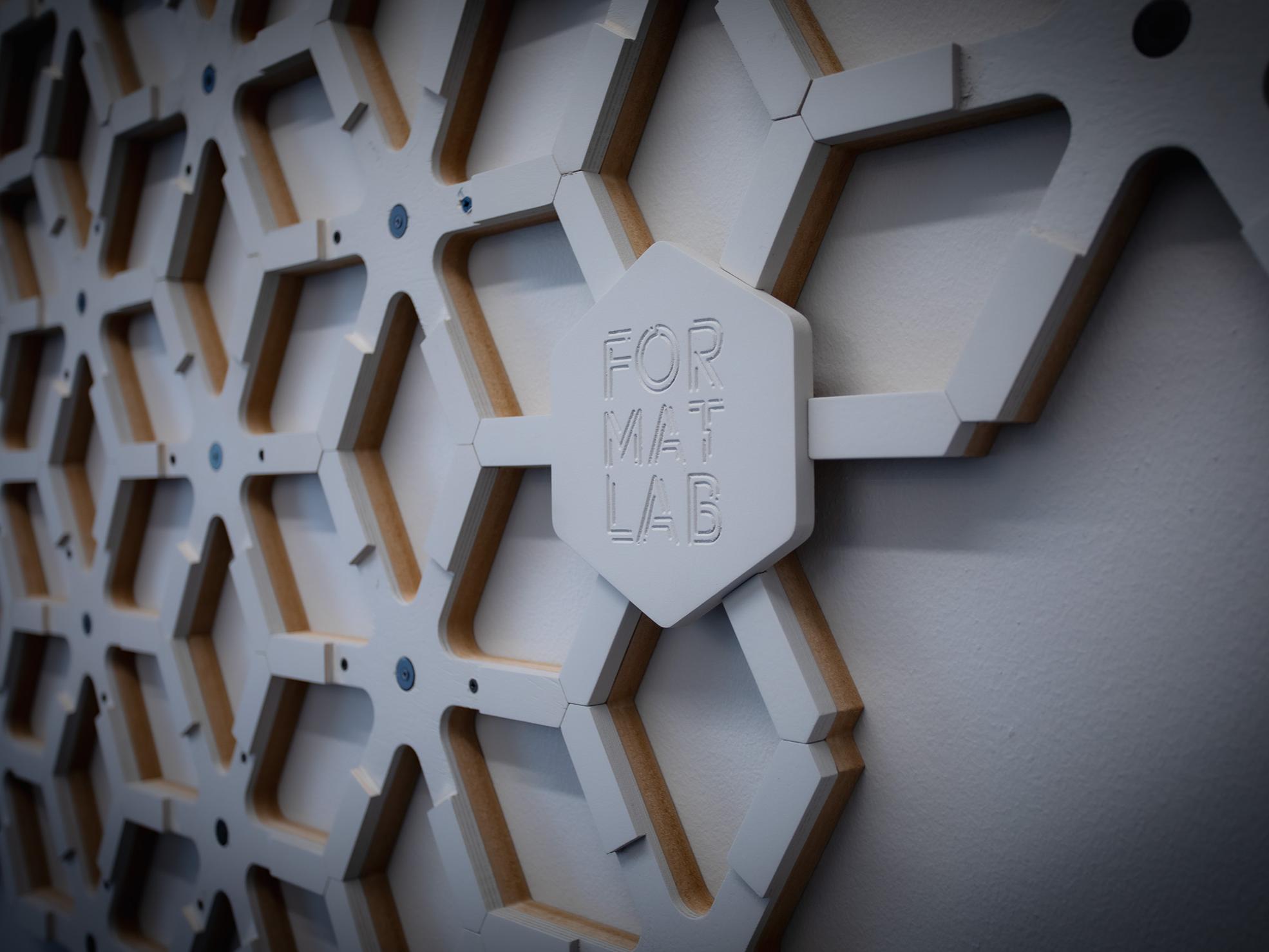 The ForMat Lab wordmark on a portion of the wall installation. 