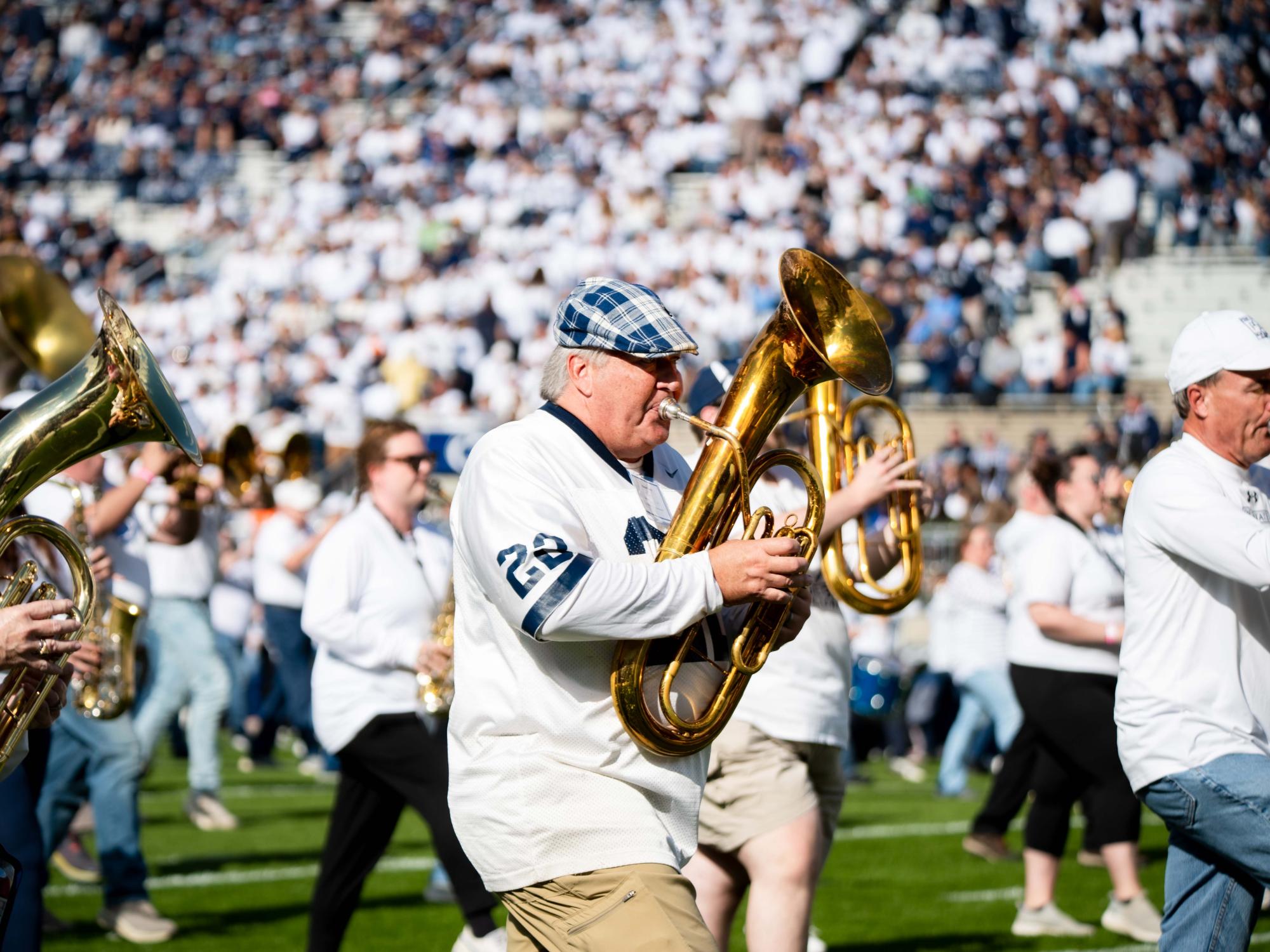 A person playing an instrument in marching band