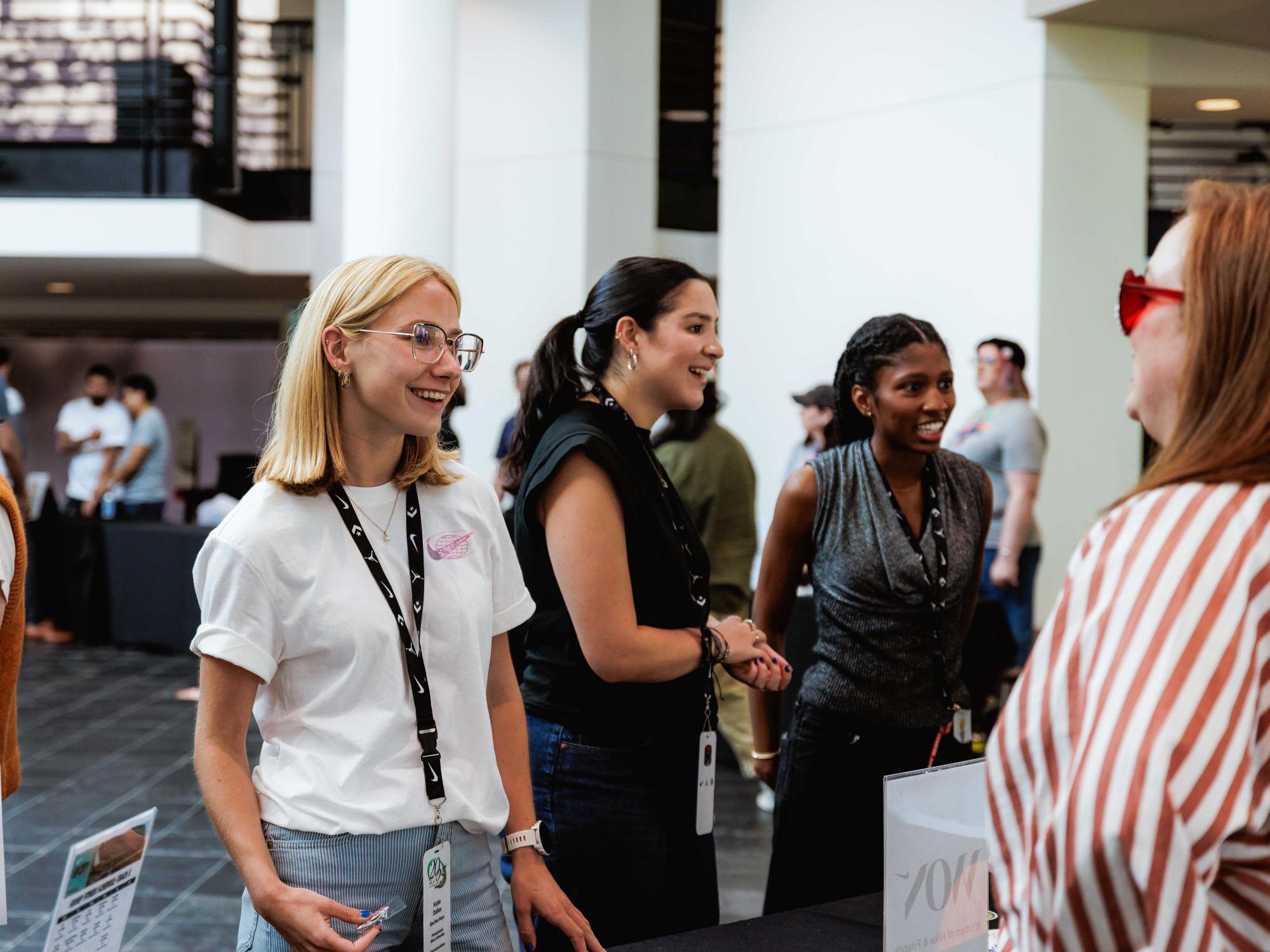 Katie Dallas chats with people at Nike World Headquarters in Beaverton, Oregon.