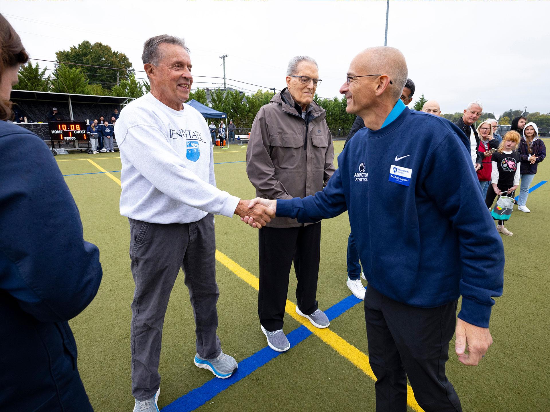 men shaking hands