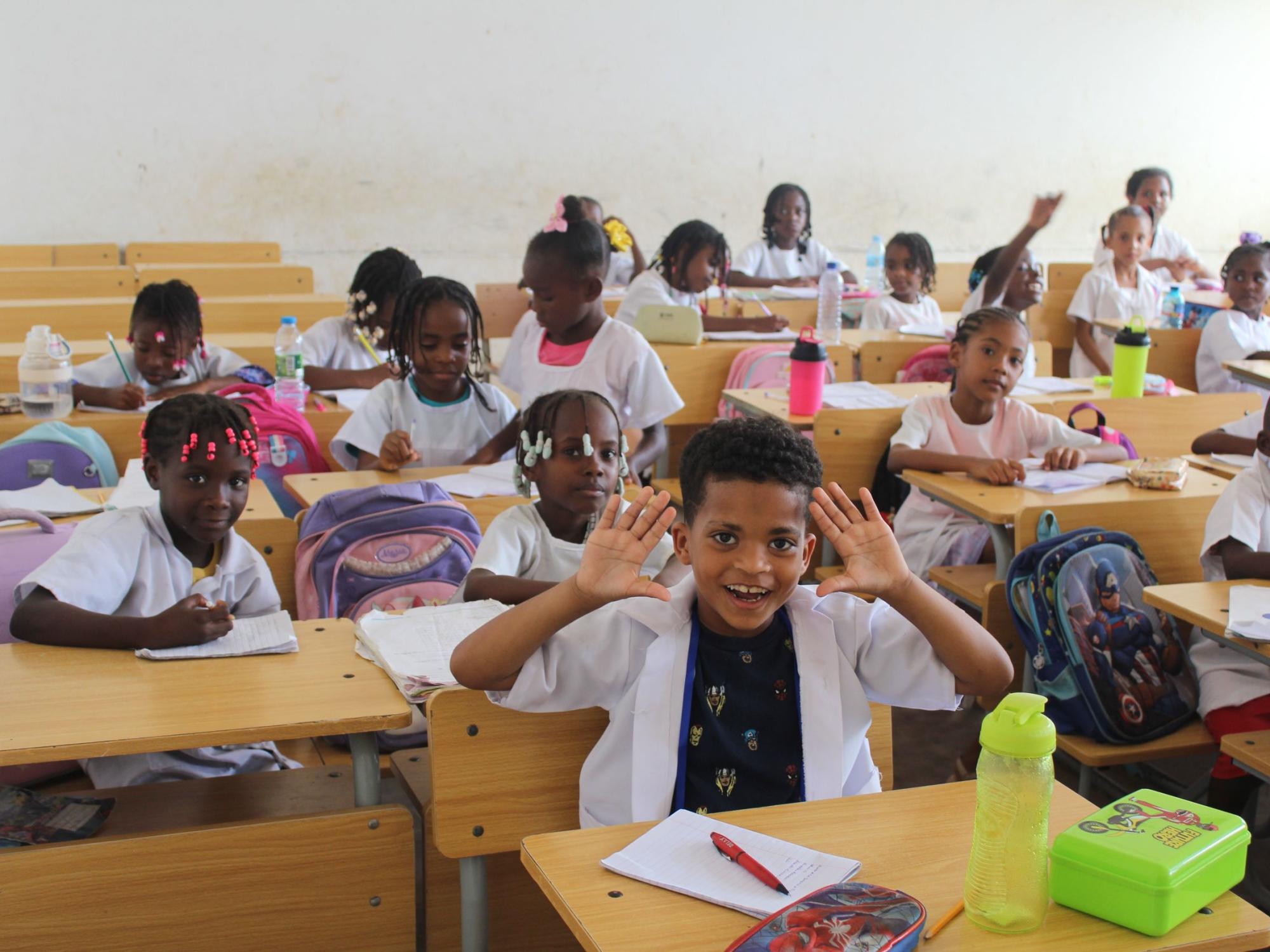 Children in Angola classroom after renovations