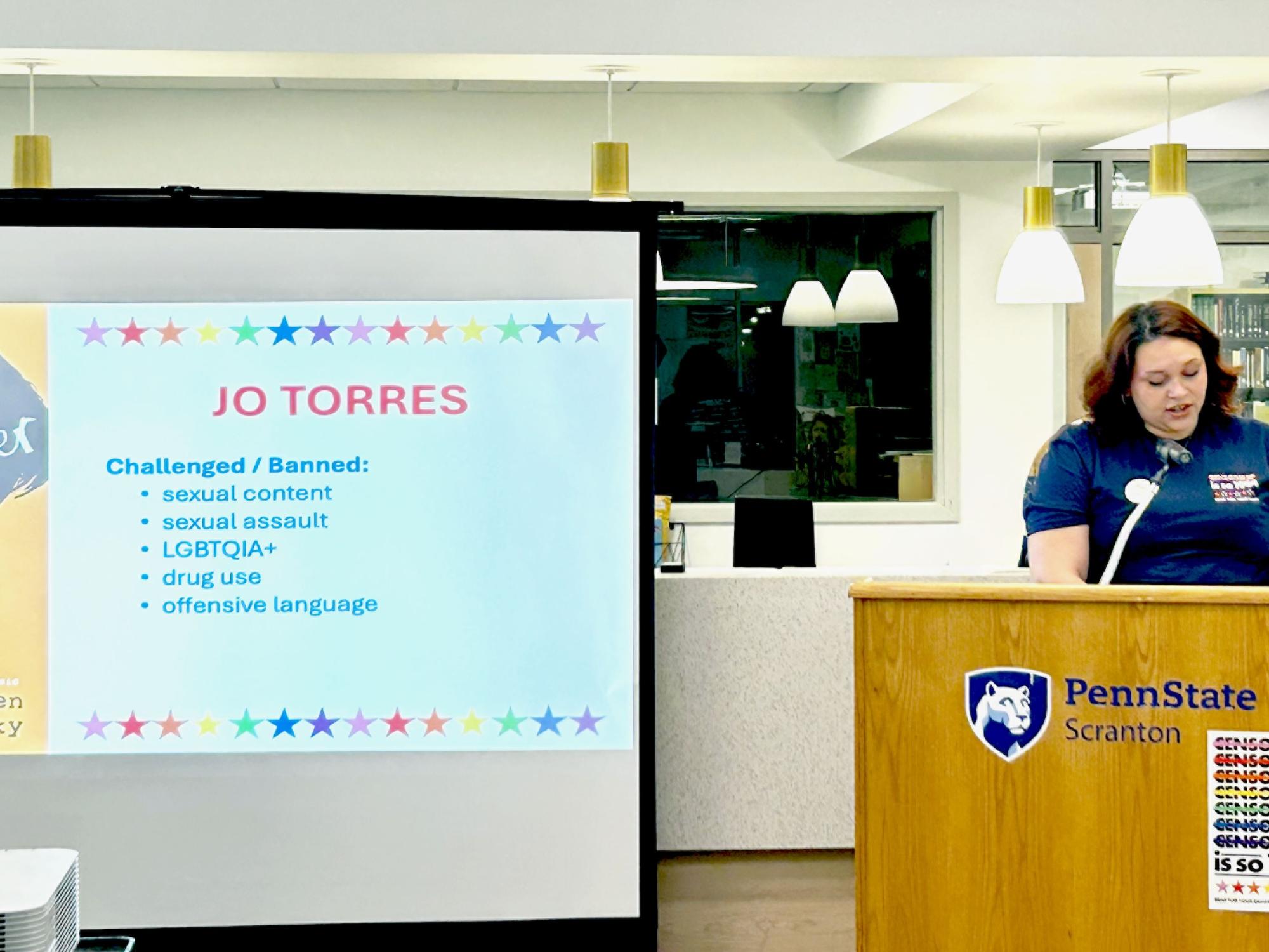 student reading at podium