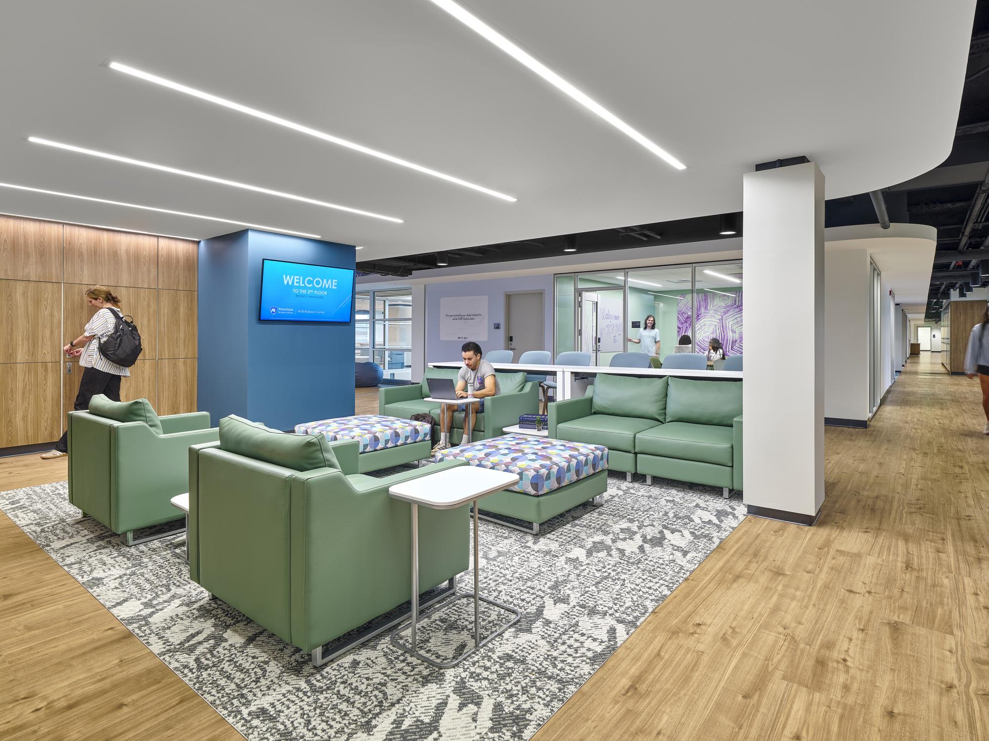 Lounge space showcasing student organization lockers on the left, which are woven throughout the entirety of the third floor, and the IPSA (Indigenous Peoples’ Student Association) office space in the center back of the photo.