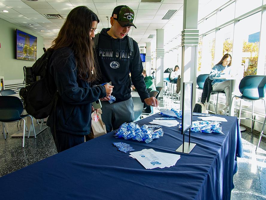 Students review some giveaways at the Nosh Kosher Deli grand opening