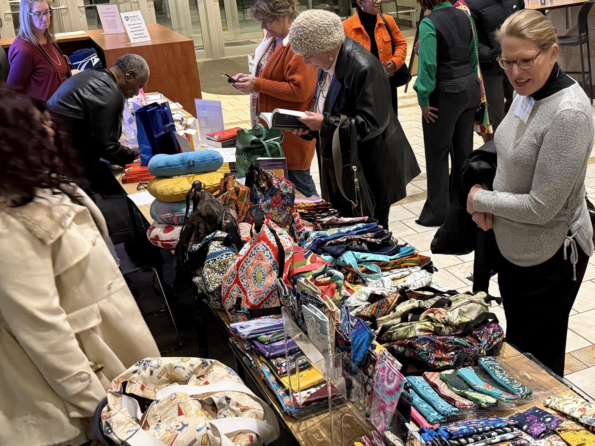 people at a table to buy books