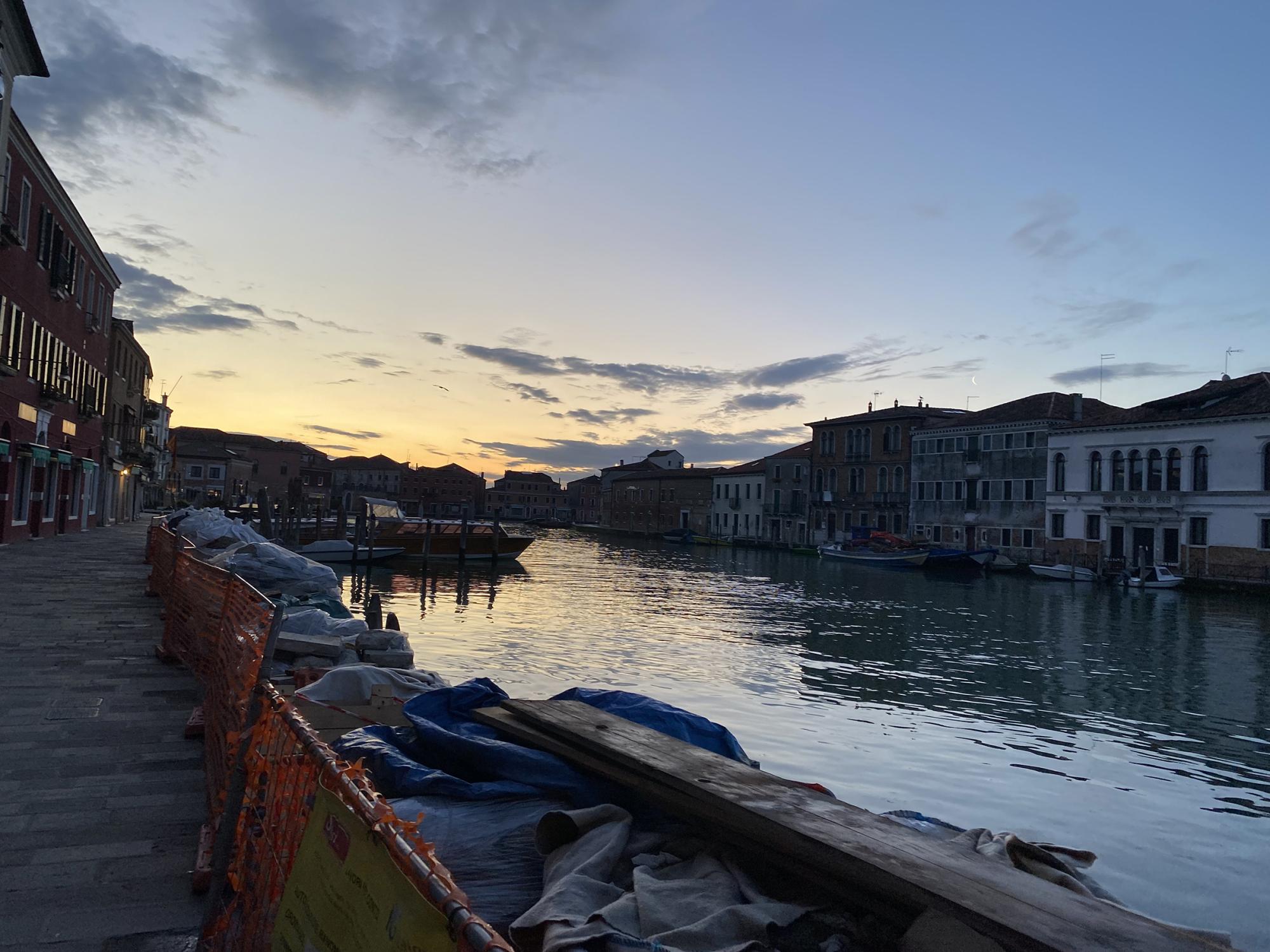 a sunset on over a seascape city