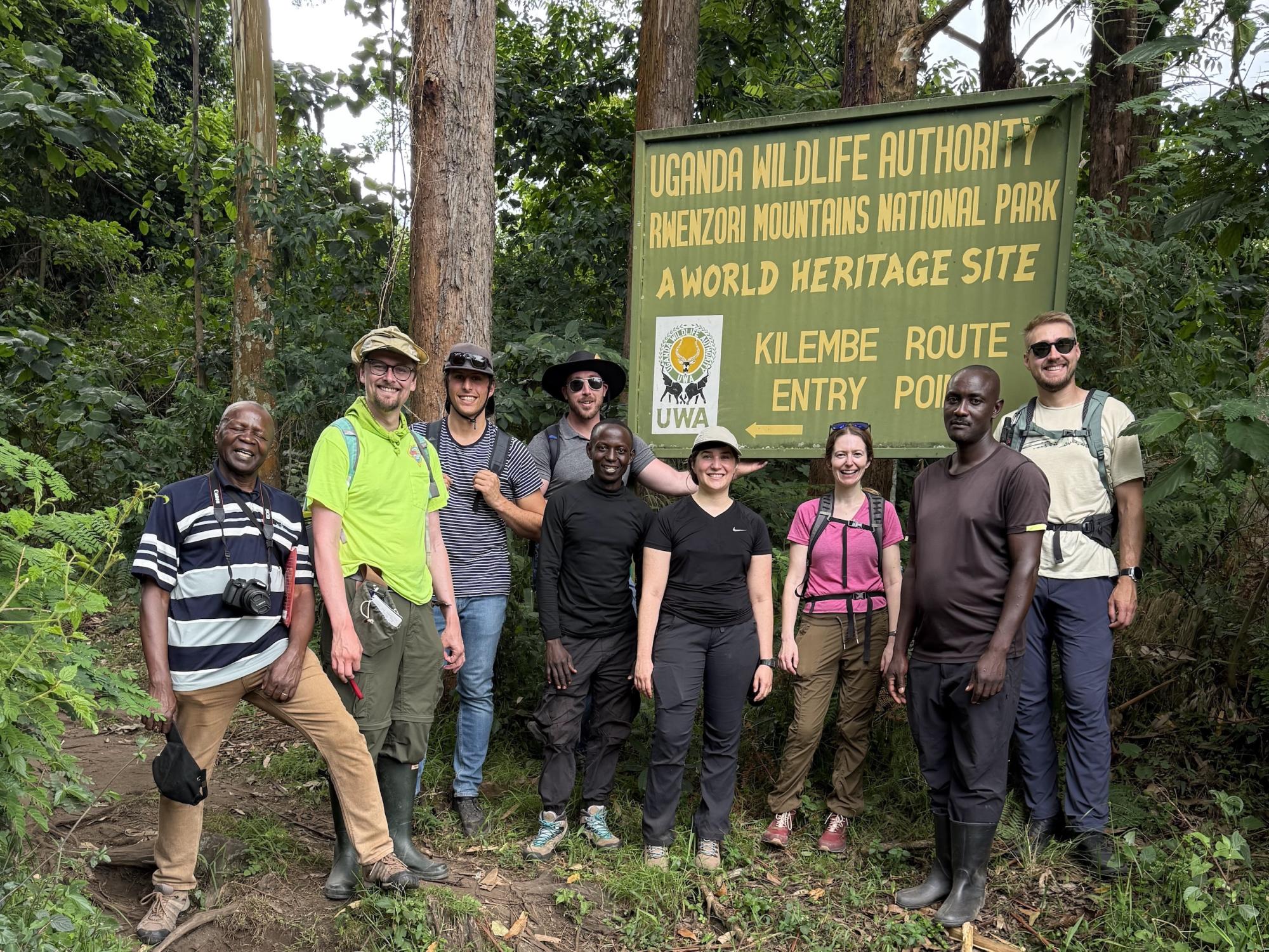 A group of collaborators poses outside Kilembe village near Rwenzori Mountains National Park on June 17, 2025.