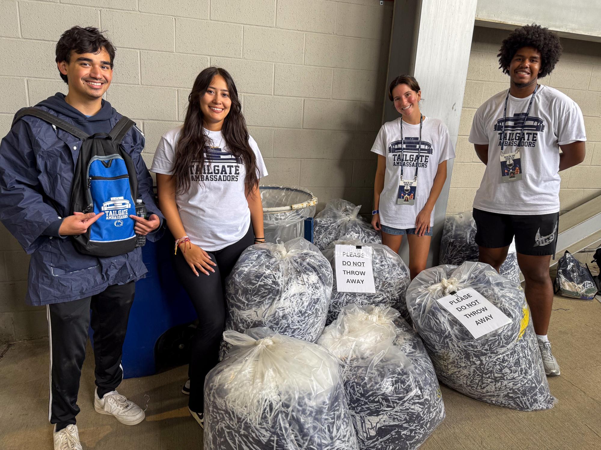Tailgate Ambassadors posing with collected shakers at PSU game