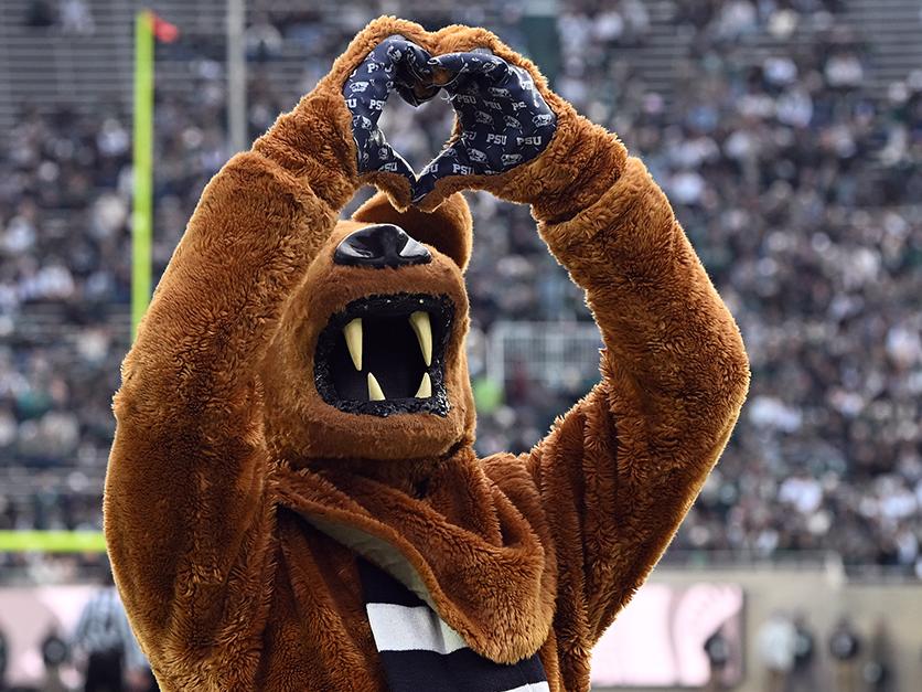 Nittany Lion mascot makes heart shape with hands