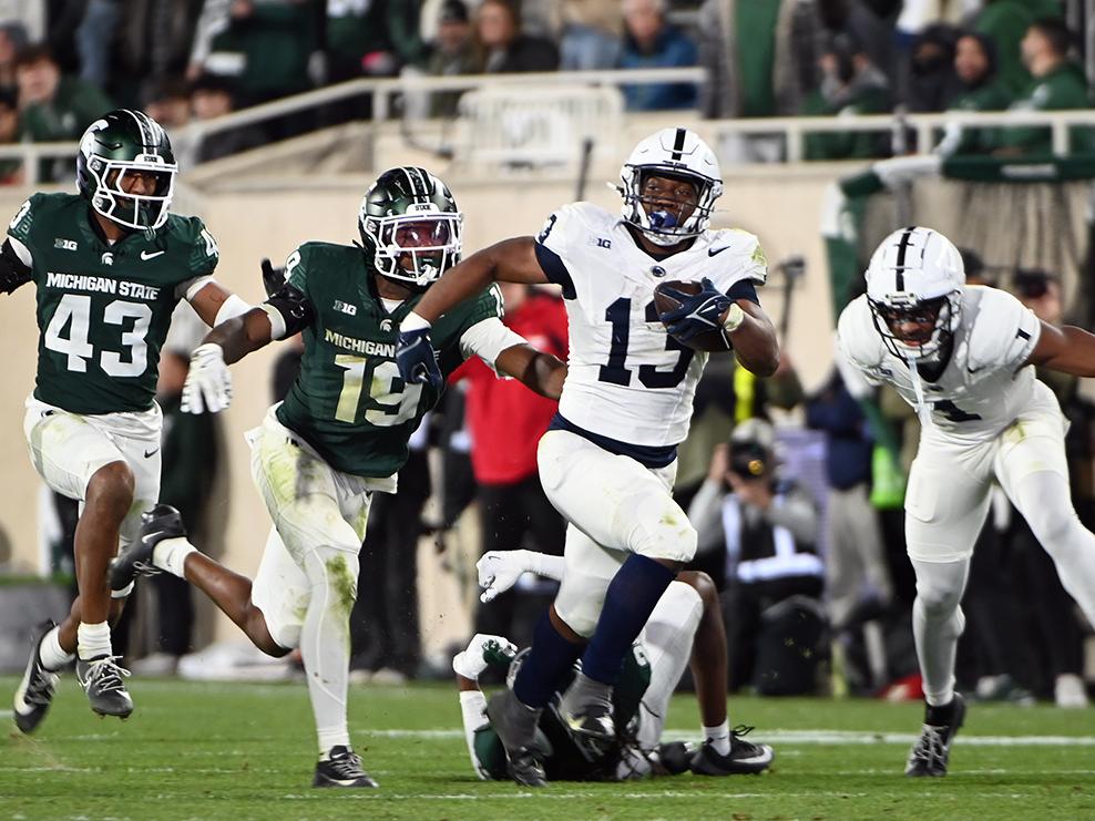 Kaytron Allen runs with ball