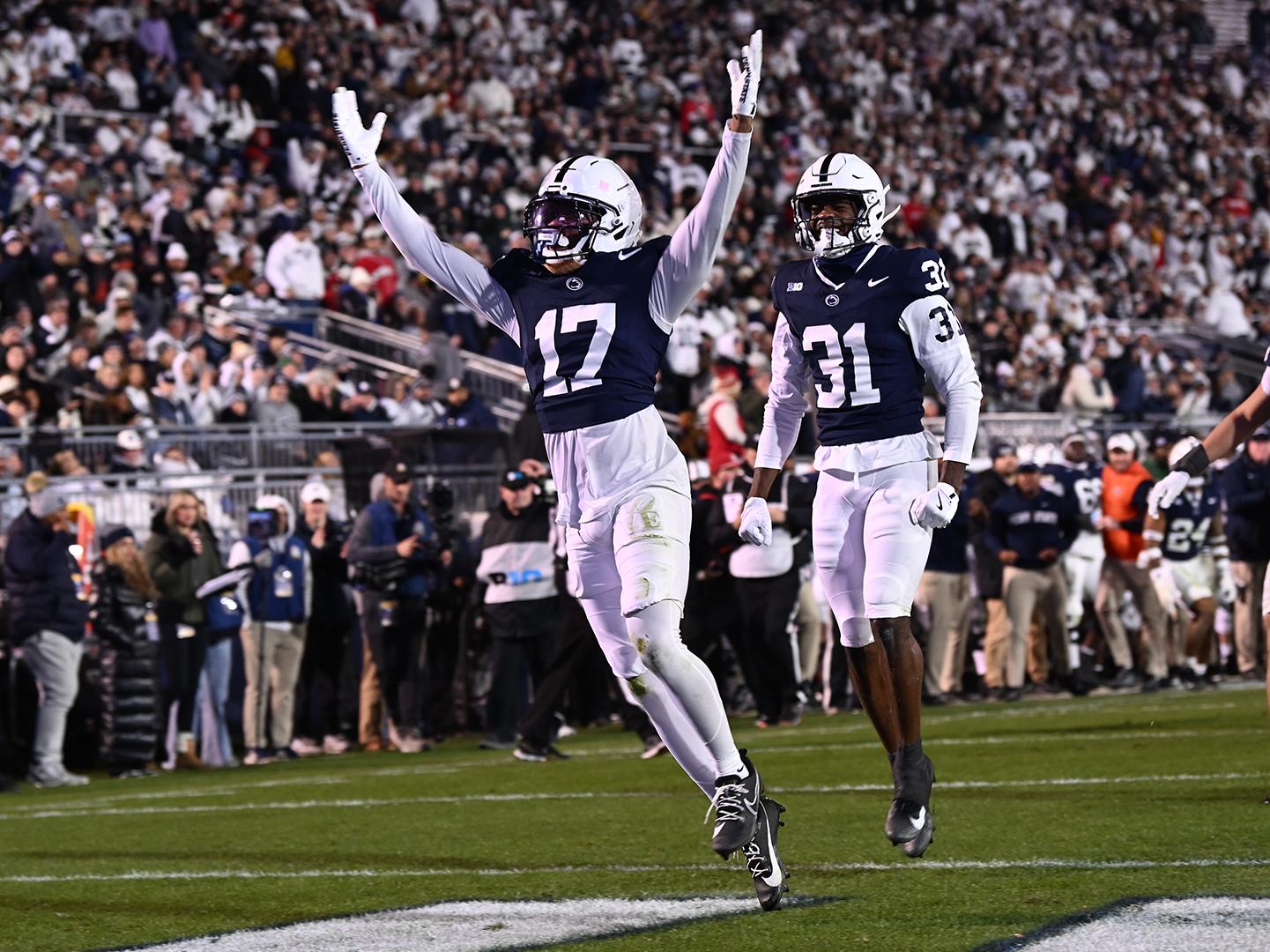 Two players celebrated in end zone