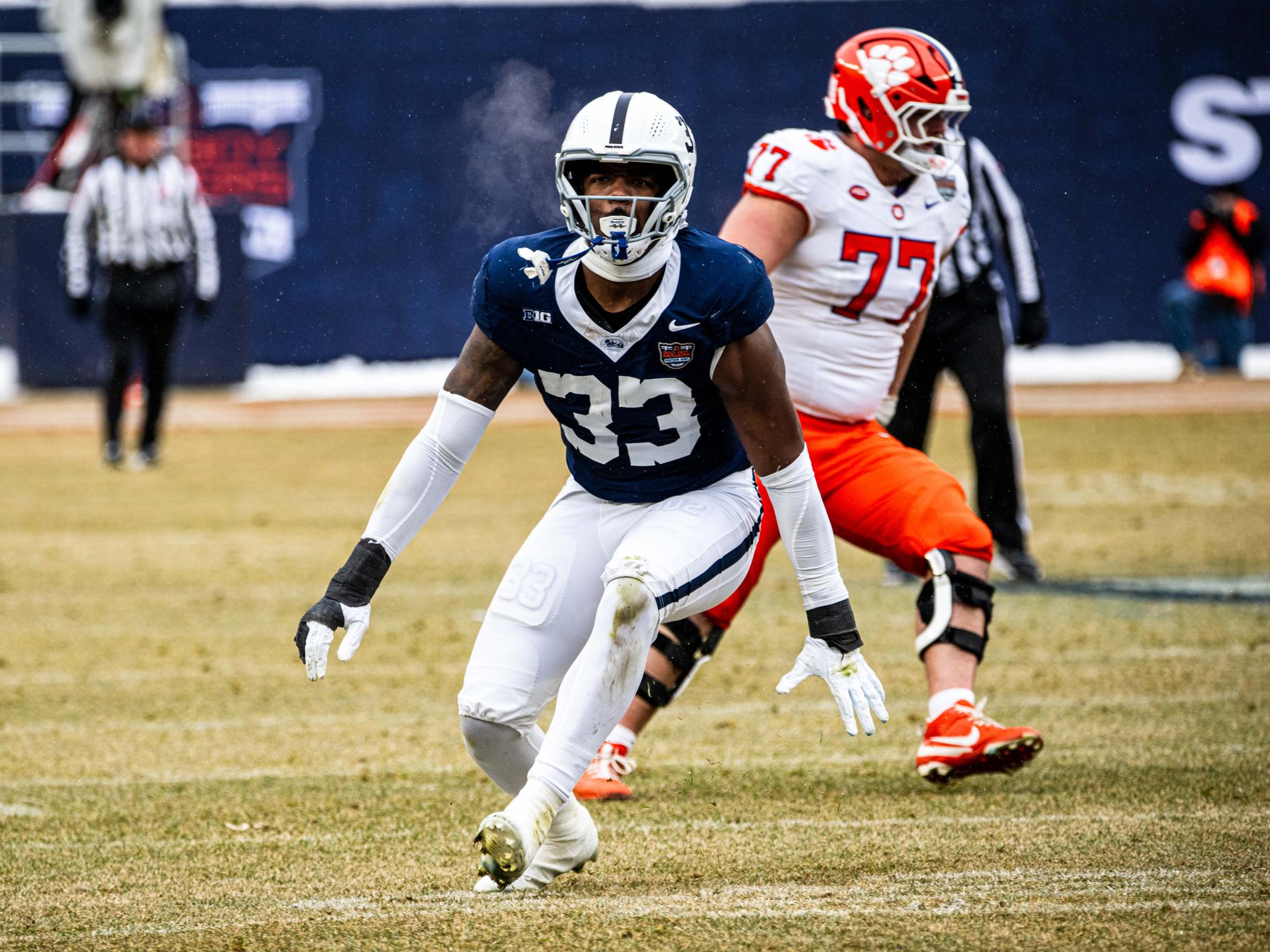 A football player looks at camera and celebrates
