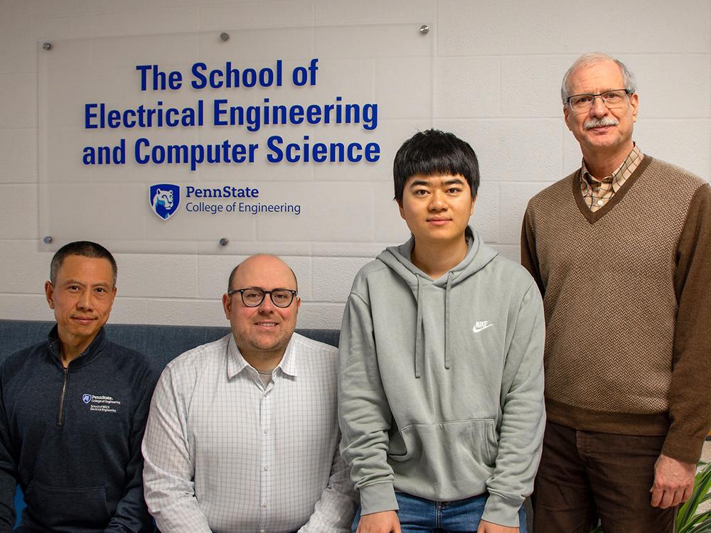 Lei Kang, Sawyer Campbell, Huanshu Zhang and Doug Werner sitting in the lobby of the Penn State School of Electrical Engineering and Computer Science.