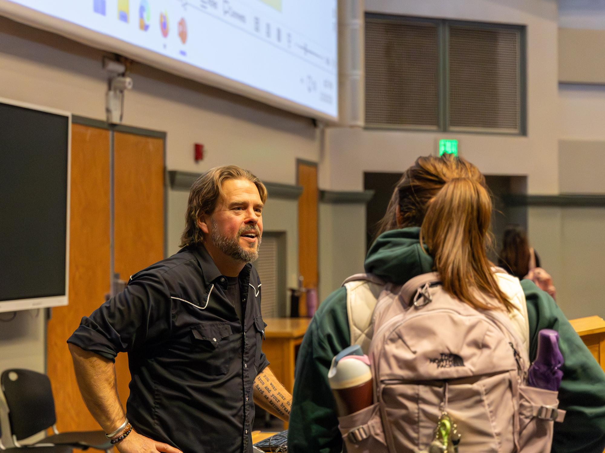 Kirk French talks to a student 