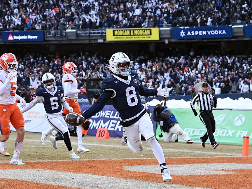 Football player crosses into end zone