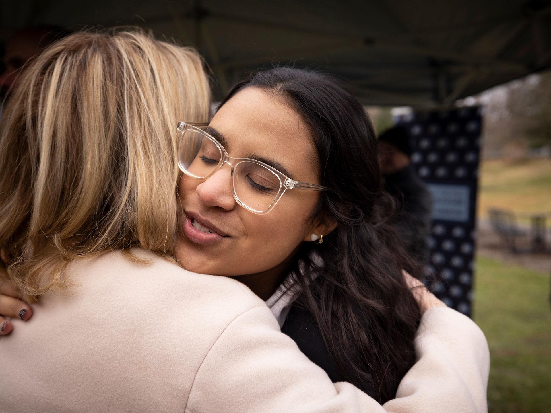 Two women hugging