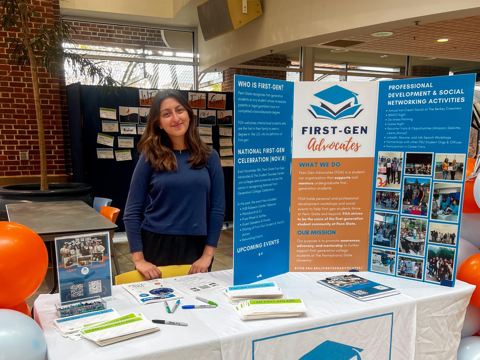 Delany Moreno tables at the First-Gen Advocates HUB takeover in November 2025.