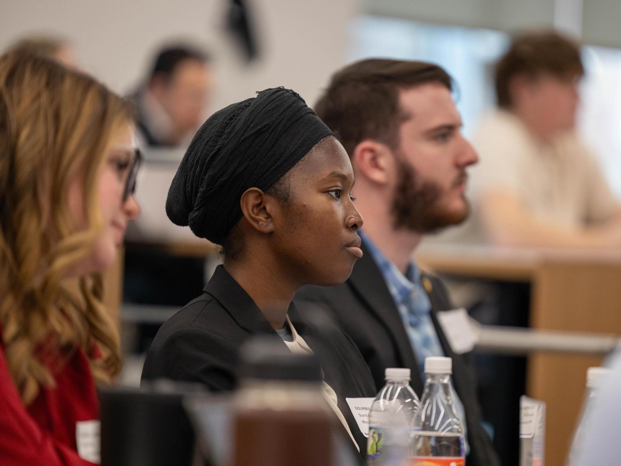 Fatoumata Doumbia listens intently during the Policy Simulation Competition in spring 2025.