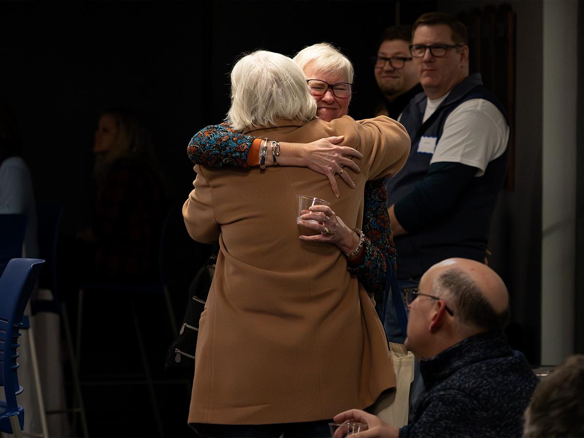 Alumni and friends greet one another during Penn State Fayette’s 60th anniversary event.
