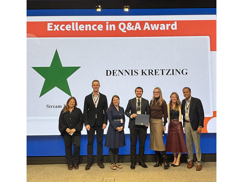 Dennis Kretzing receiving award from judges at 2025 HR Case Competition 