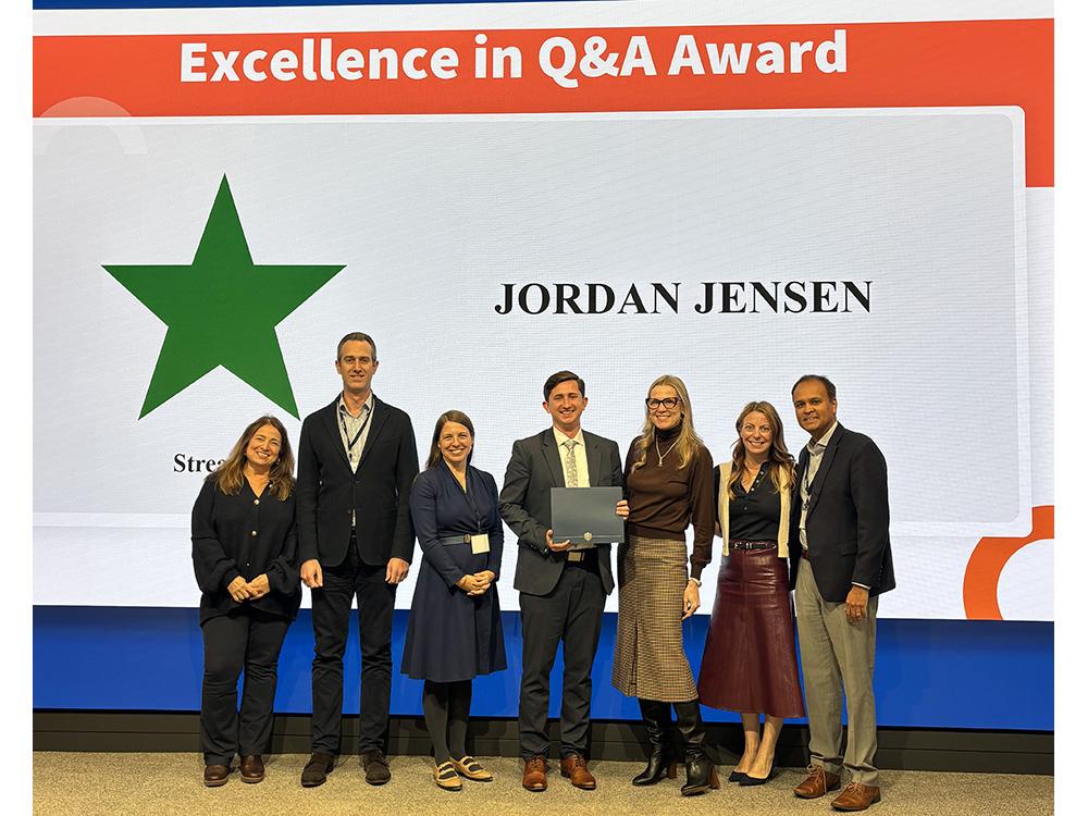 Jordan Jensen receives award from judges at 2025 HR Case Competition