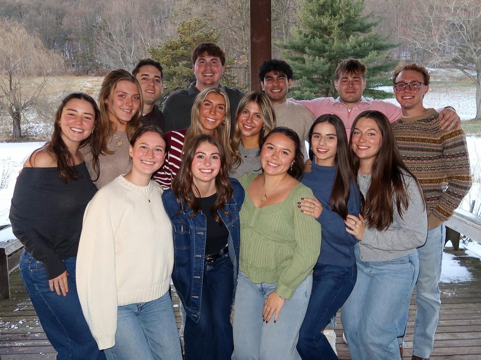 Kayla Lynch gathers with her pledge class from Delta Sigma Pi.