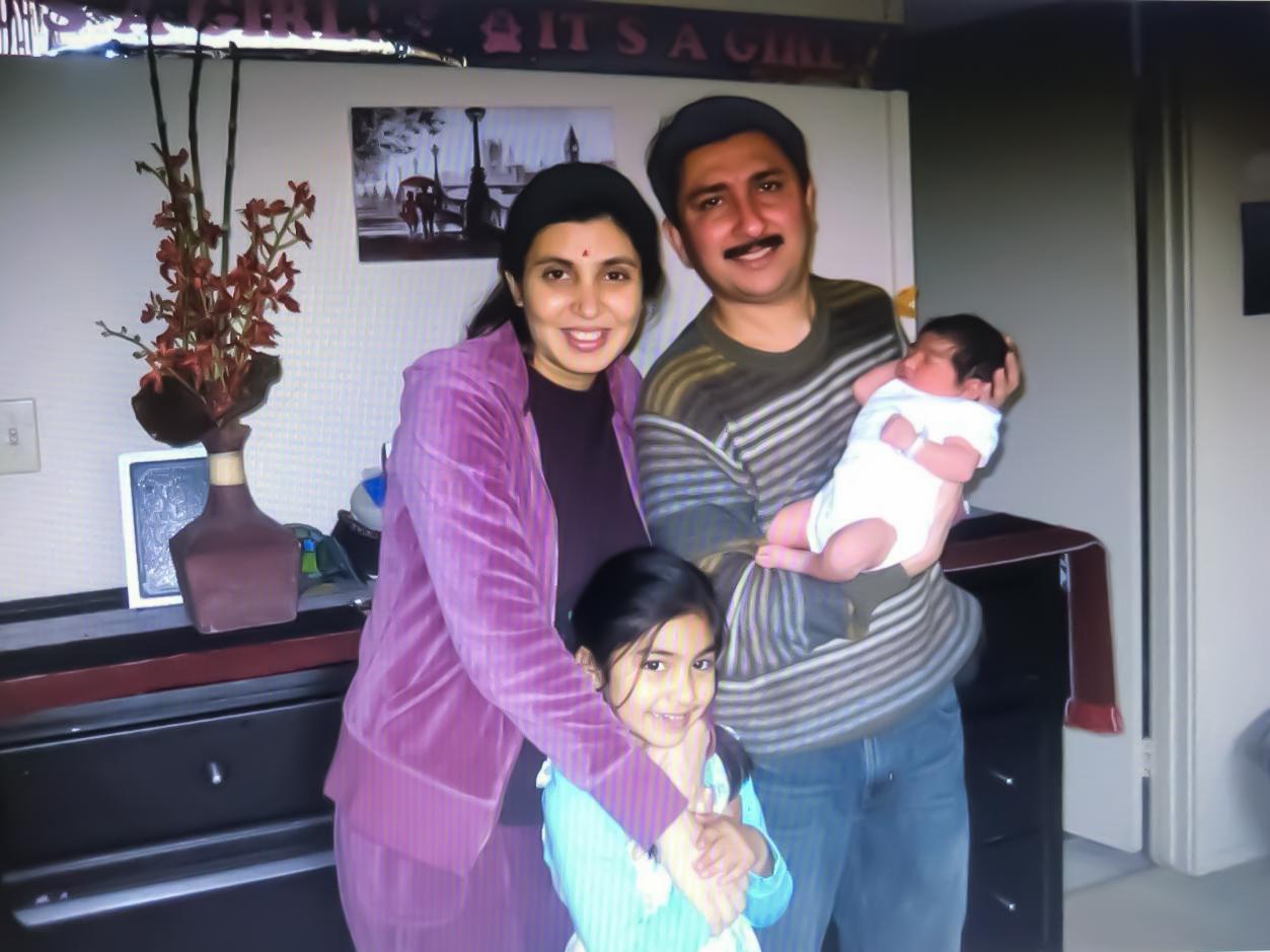 A young Vama Maniar with her parents and then-baby sister.