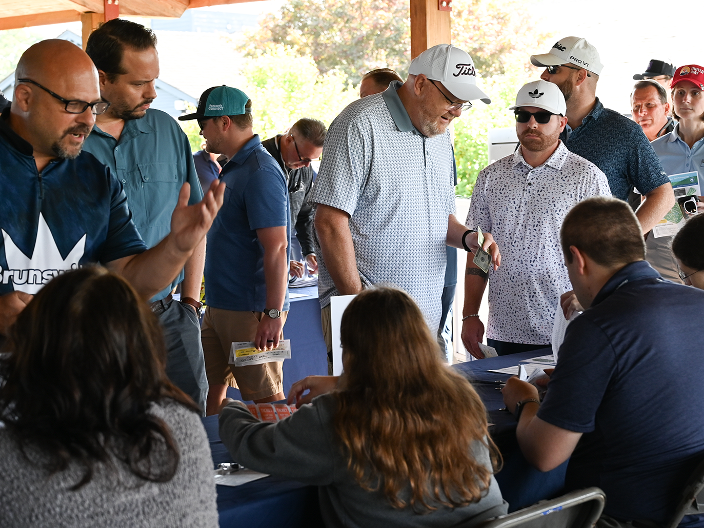 Golfers register at the Penn State IT Golf Tournament