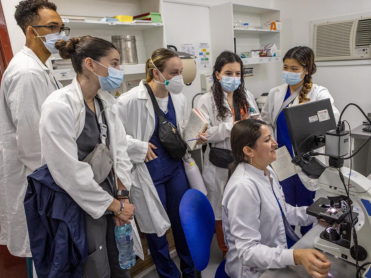 Six Penn State undergraduates in a hospital lab in Ecuador