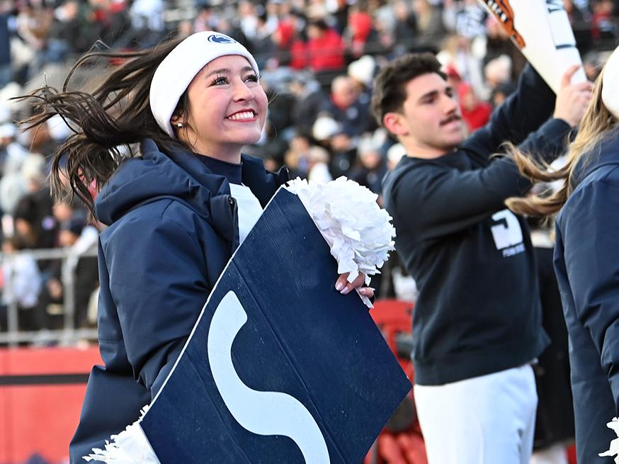 Cheerleader holding sign