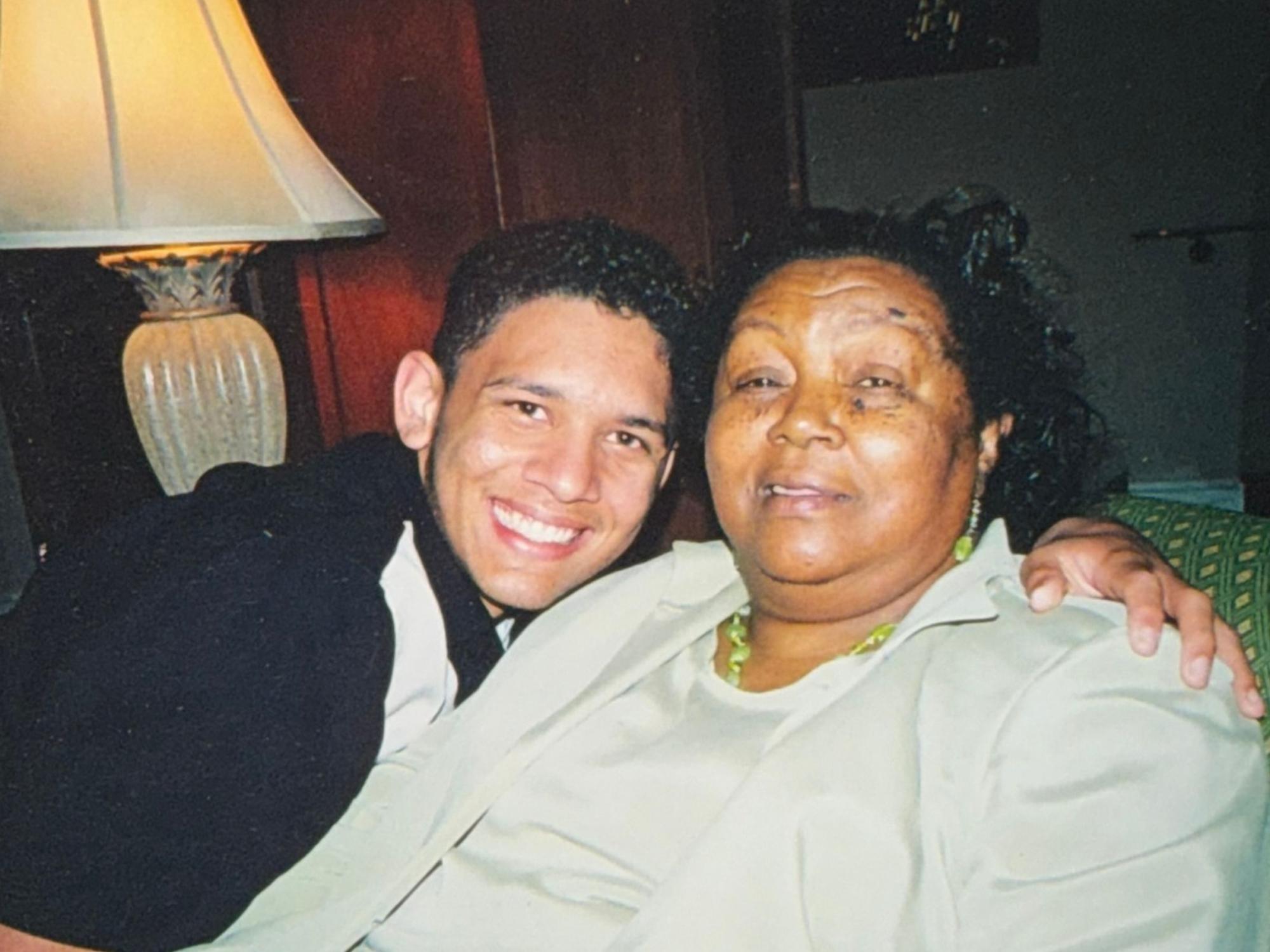 smiling teen hugs grandmother