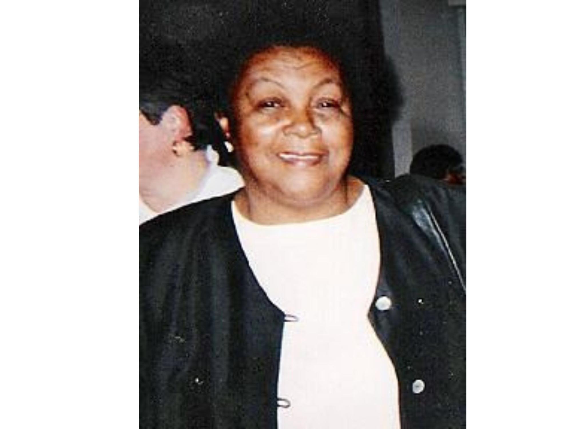 smiling person wearing black and white