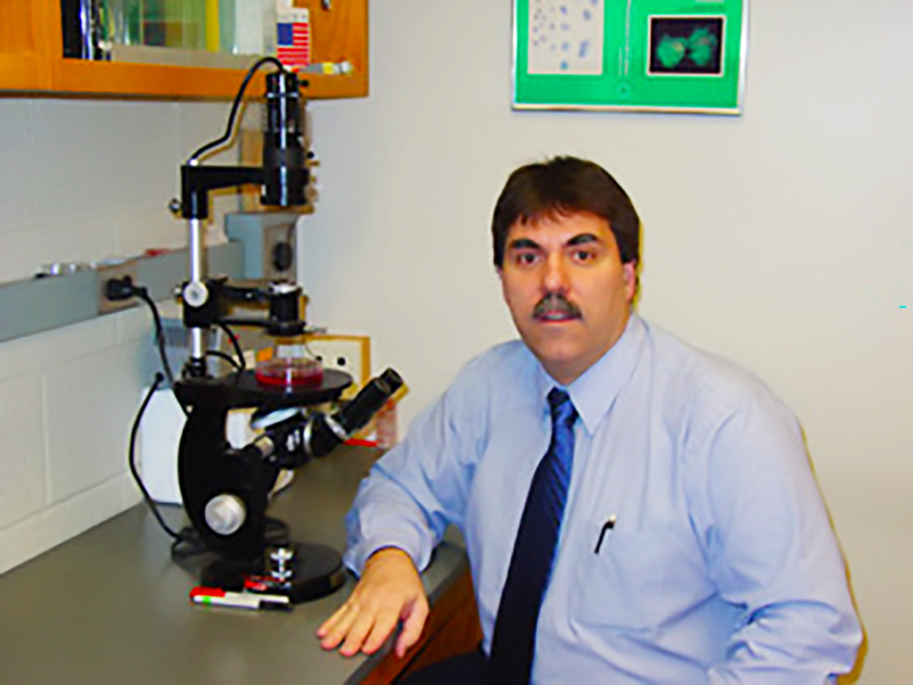 Verderame in front of a microscope in the 1990s.