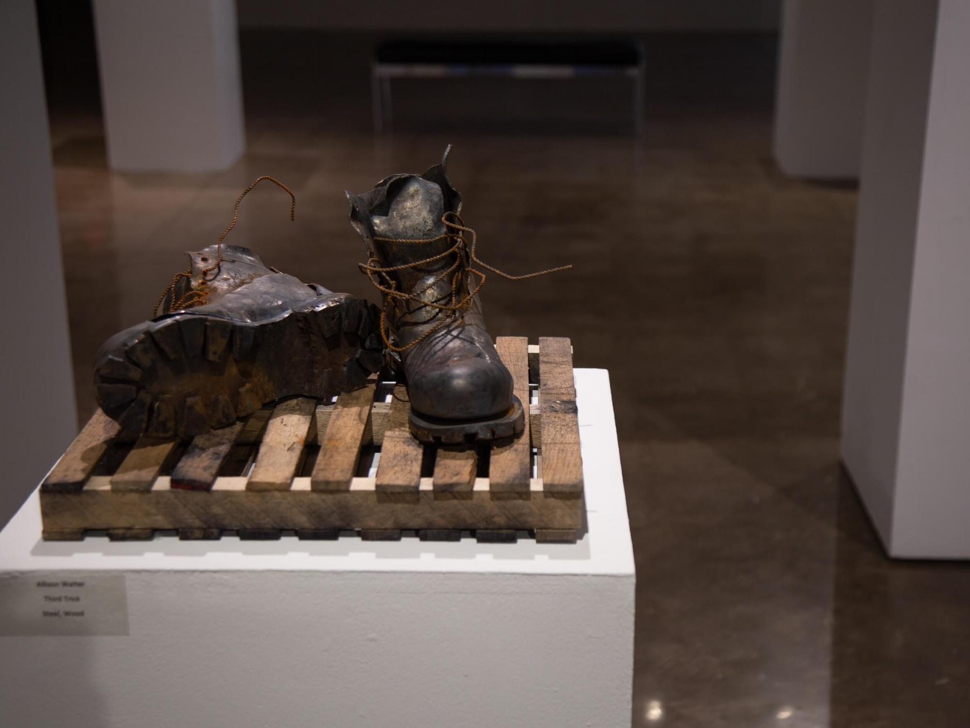 Pair of hiking boots in an art exhibit