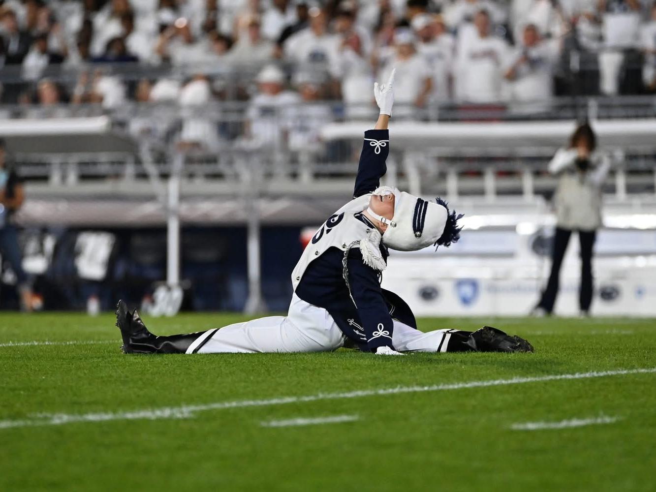 Ellie Sheehan performs as Penn State Blue Band drum major at Beaver Stadium.