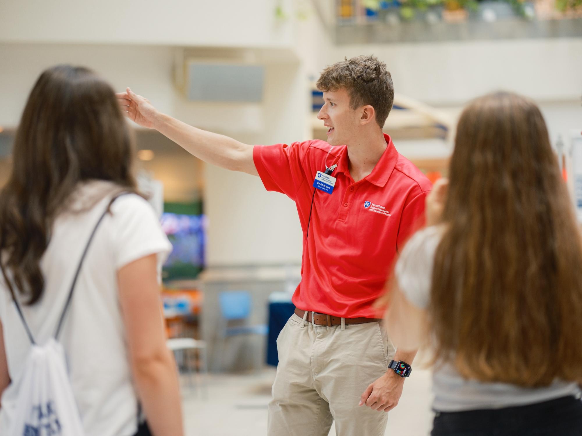 Orientation leader helping new students during NSO