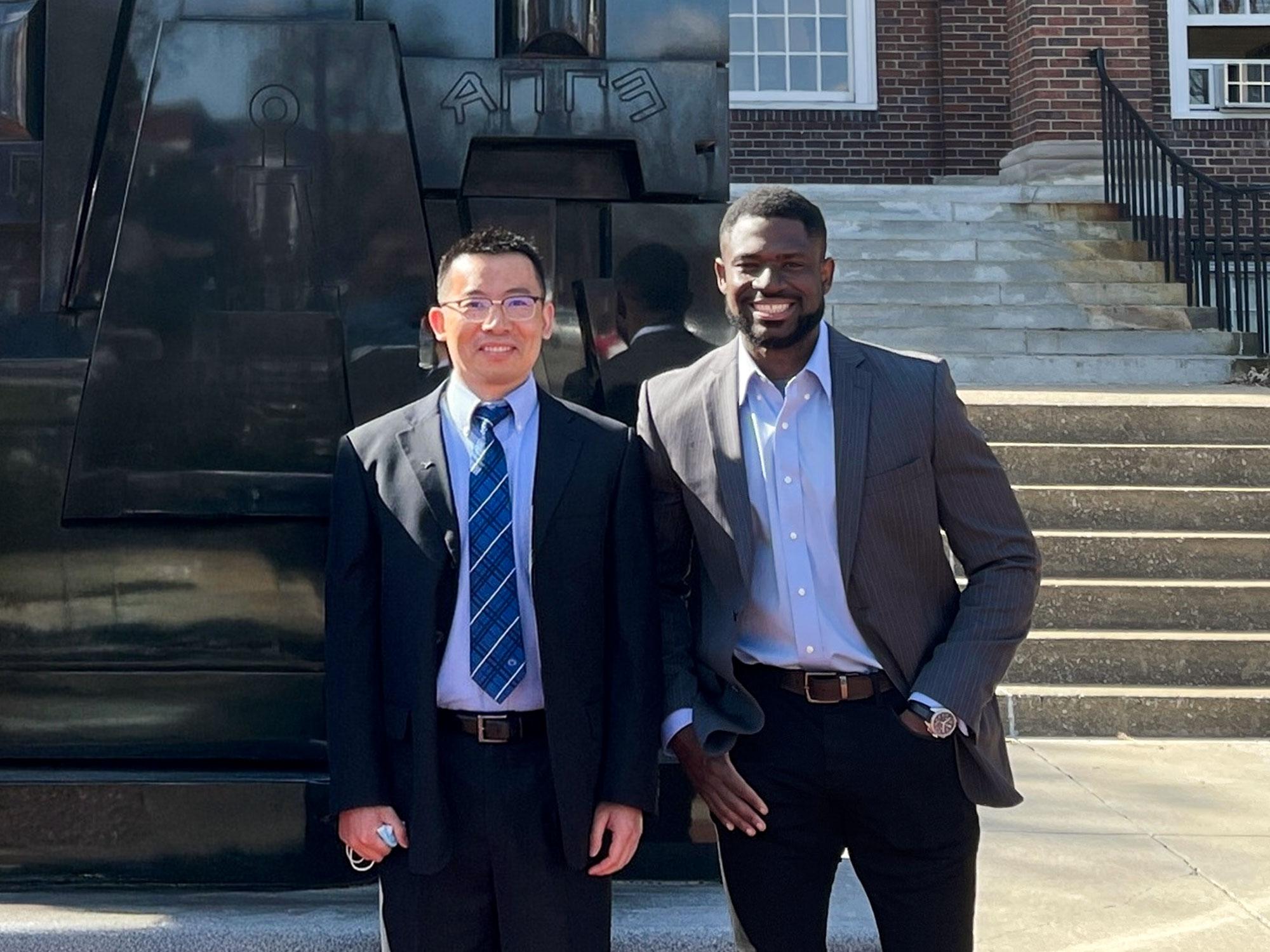 Hui Yang, Gary and Sheila Bello Chair in Industrial and Manufacturing Engineering, and Kevin Mekulu, an industrial engineering and operations research doctoral candidate, posed outside together, smiling into the camera