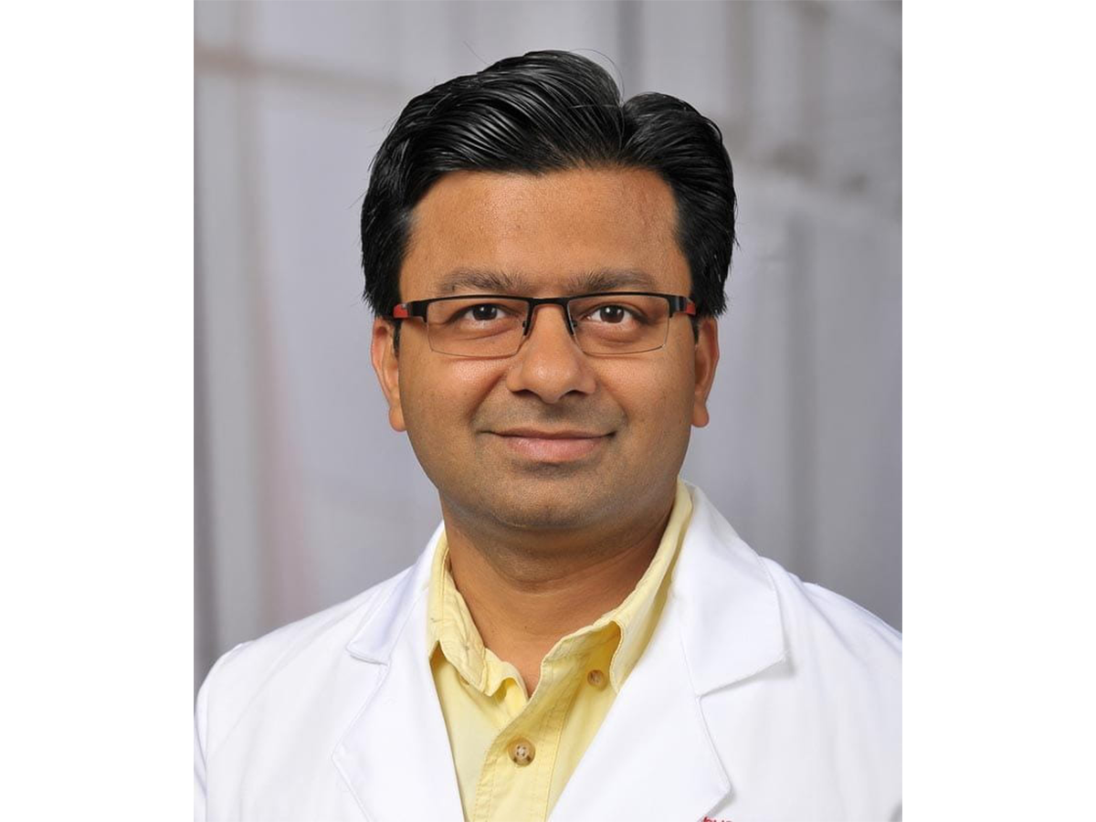 Photo of physician in a white lab coat