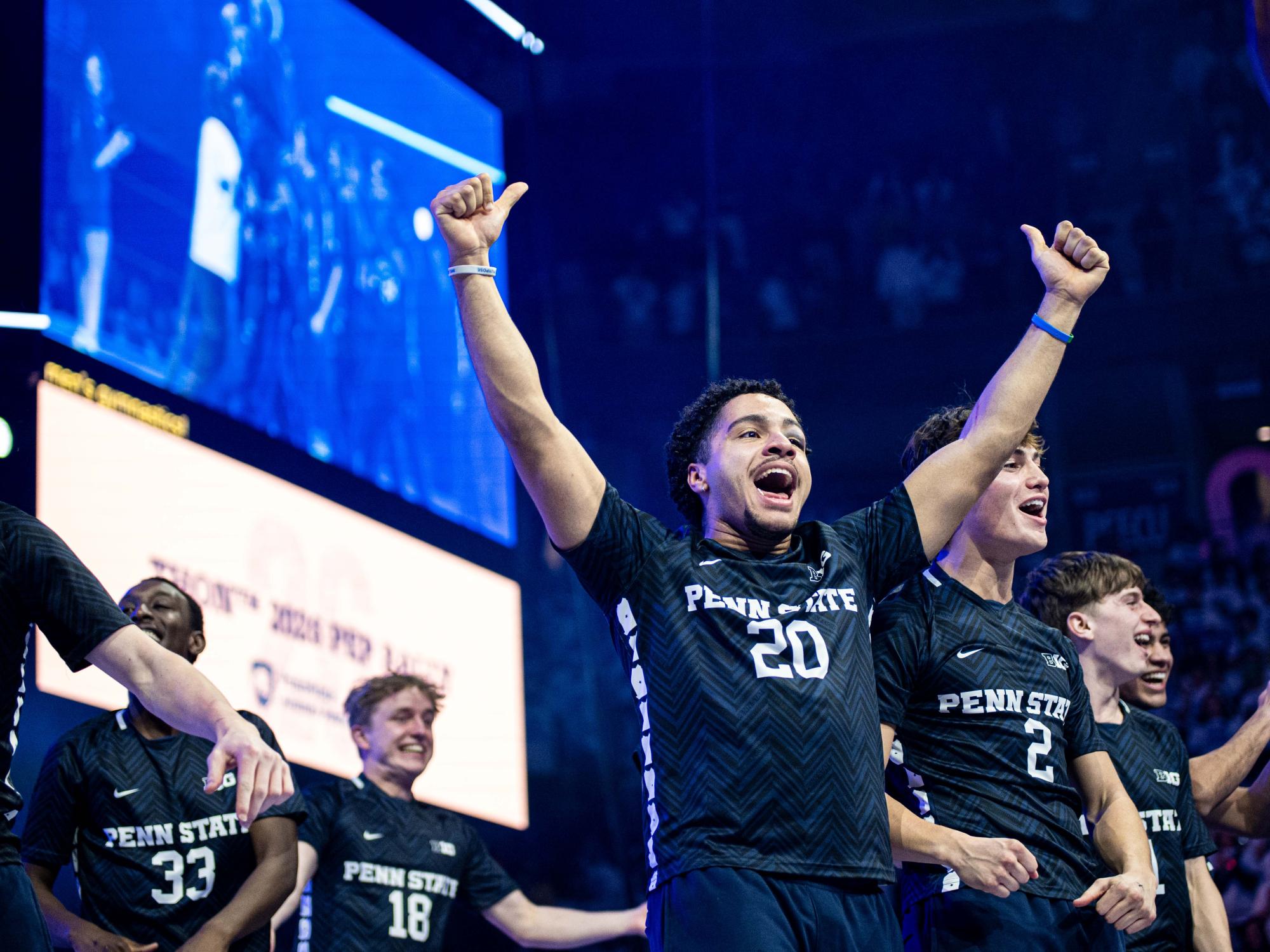 A person celebrating with their arms up in the air