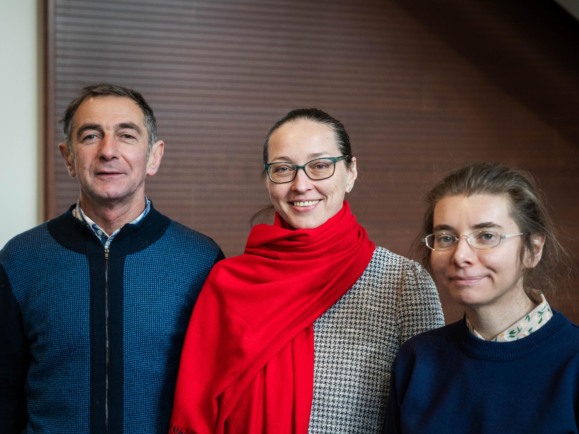 From left, Oleksandr Gon, Mariia Grytsenko and Yuliya Ladygina gather inside Burrowes Building. 