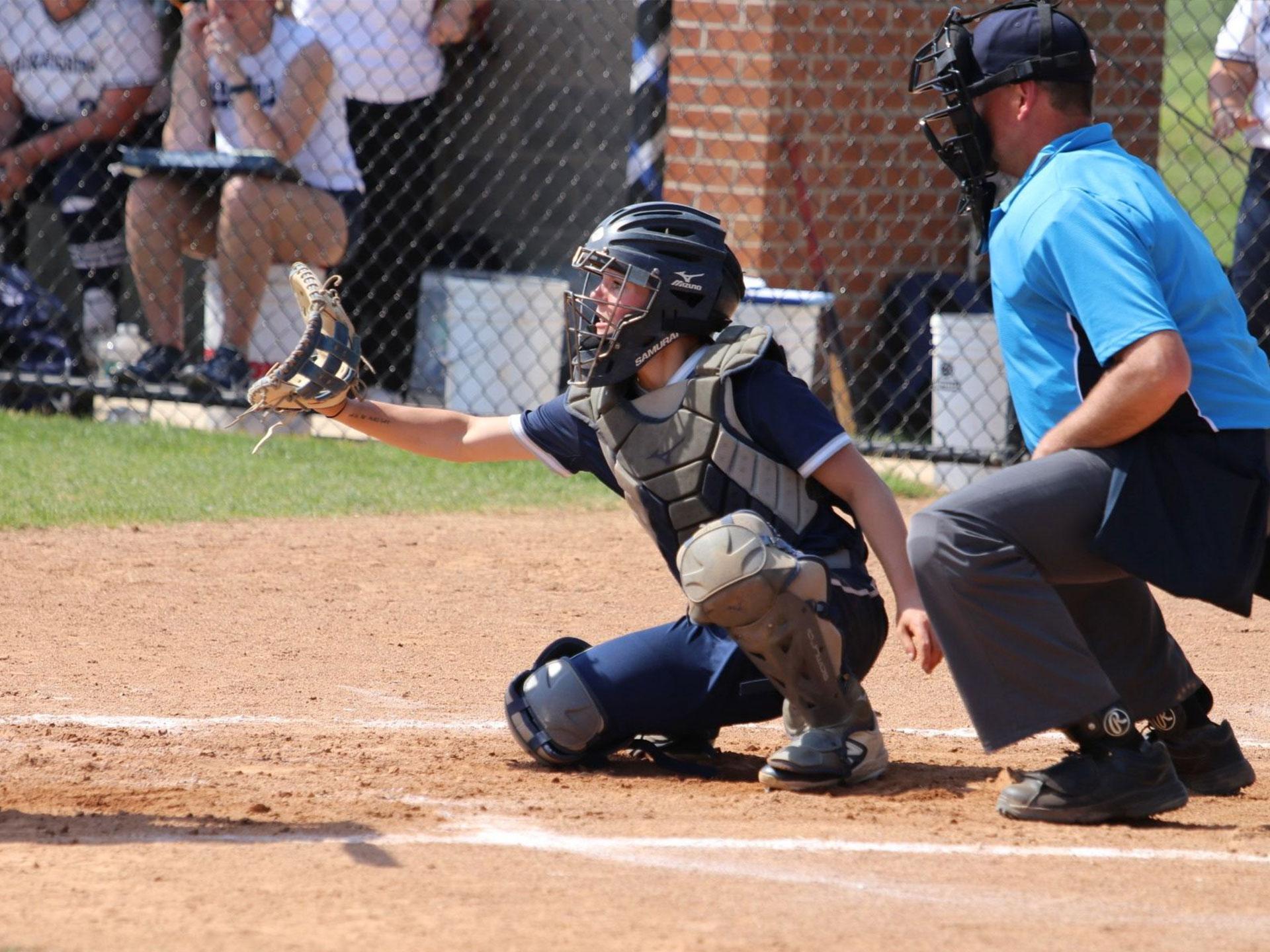 softball catcher and umpire at home plate