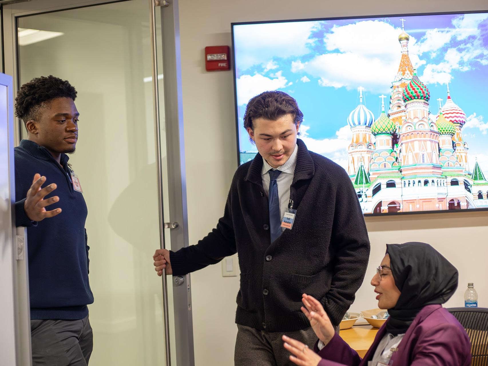 SIA student Lawson Kidd (left) negotiates with members of the Russian delegation.