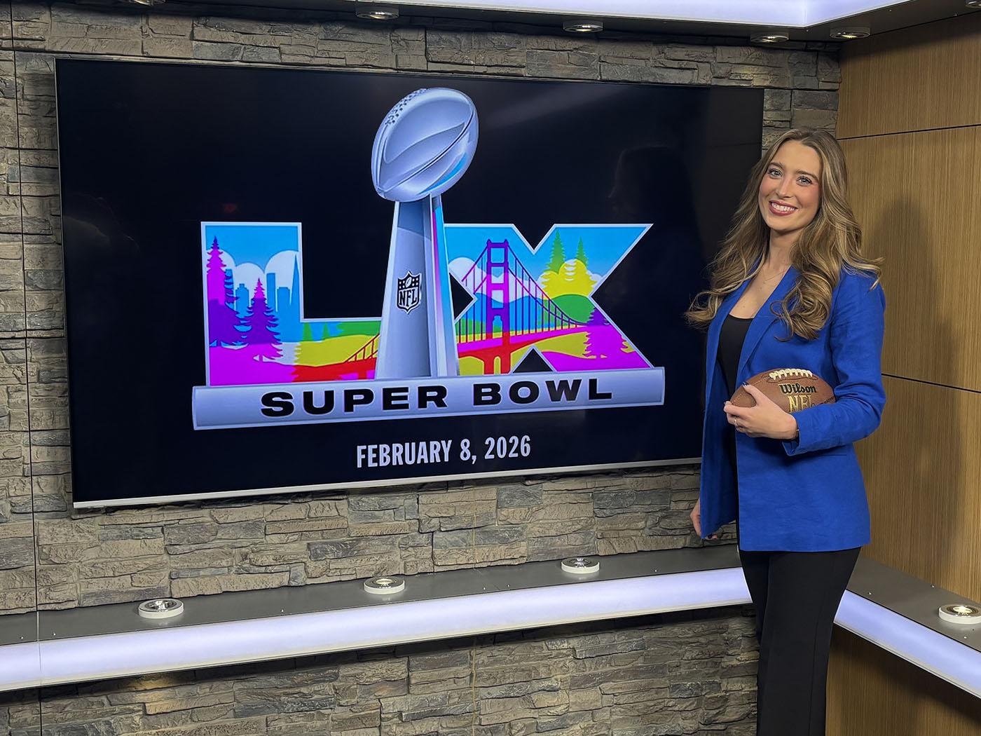 Cailey Thalman holding football