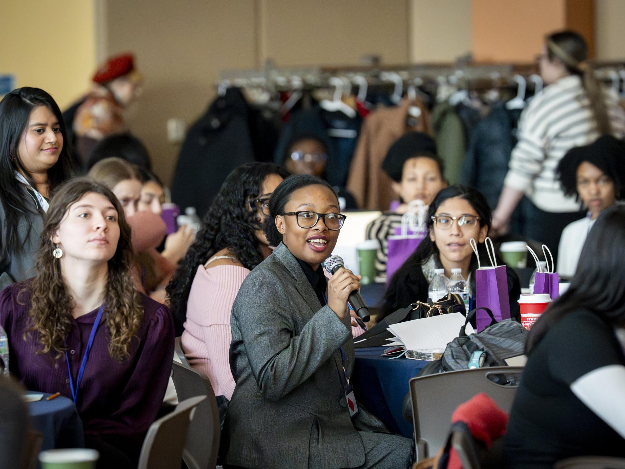 Empower 2026 attendee asking a question from the crowd.