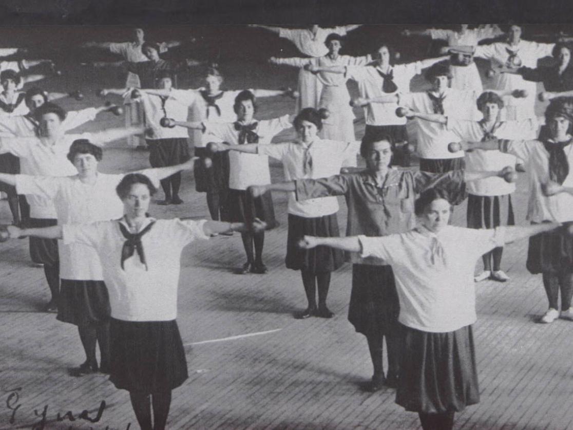A black and white picture of students in phys ed class in 1914